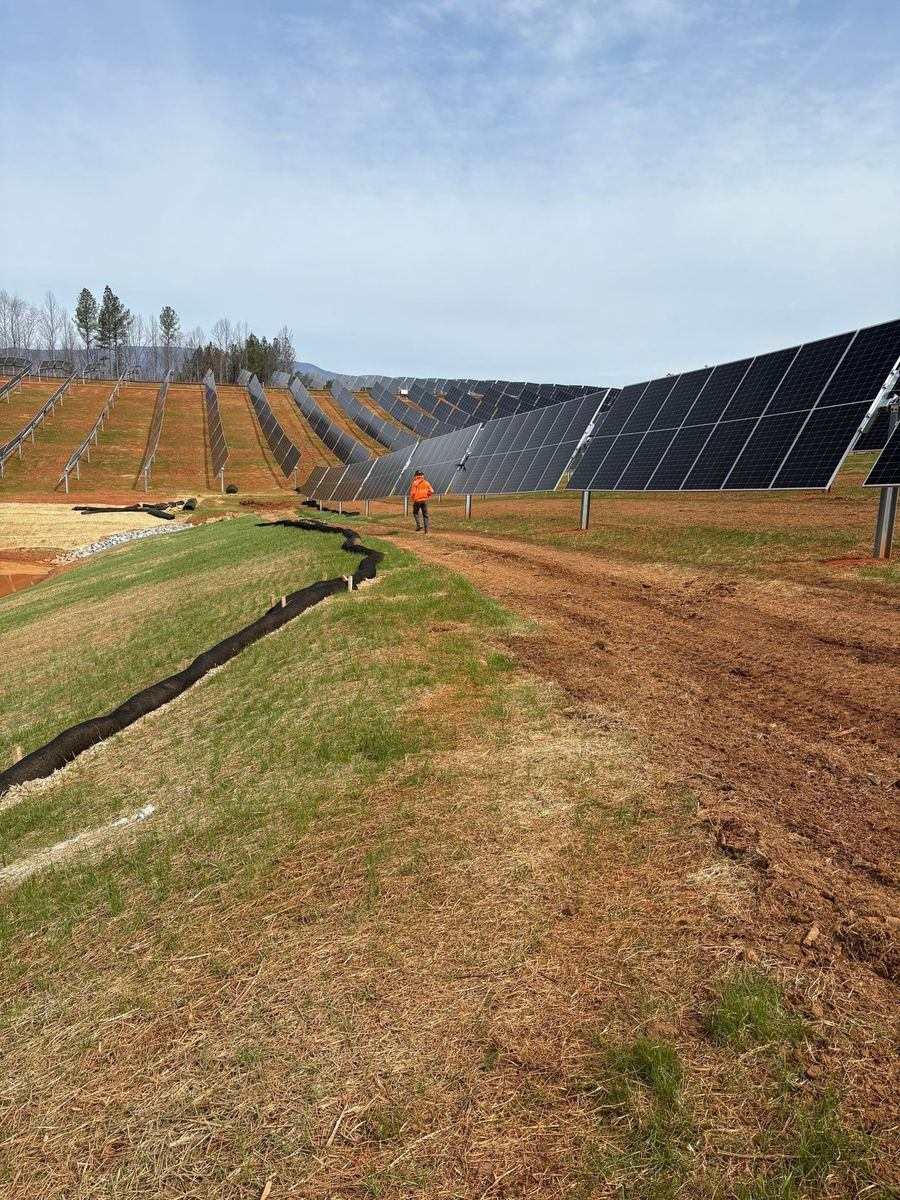Solar panel rows and erosion control work at the Afton solar field