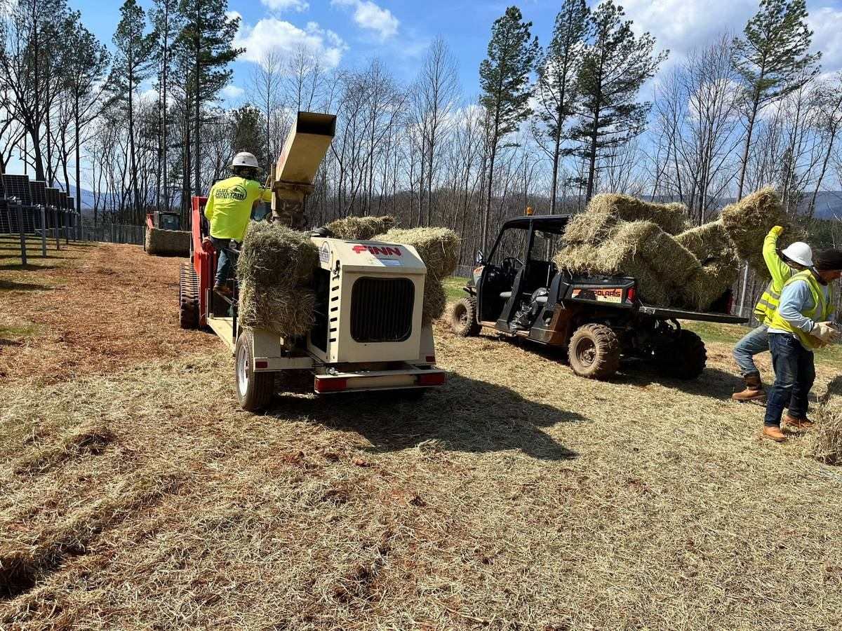 Blue Mountain crew blowing straw for slope stabilization at the Afton solar field