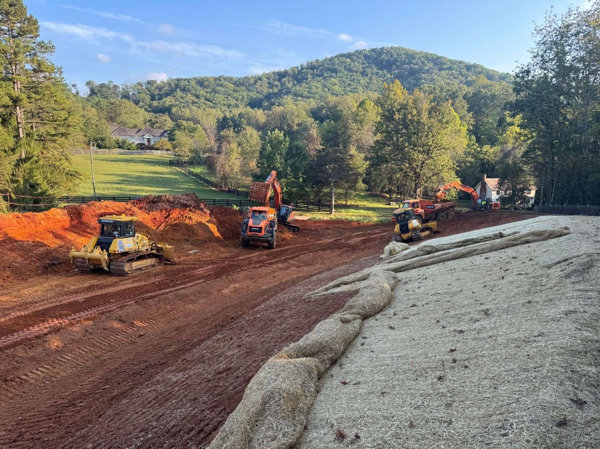 Stabilized access and earthwork across a sloped construction site