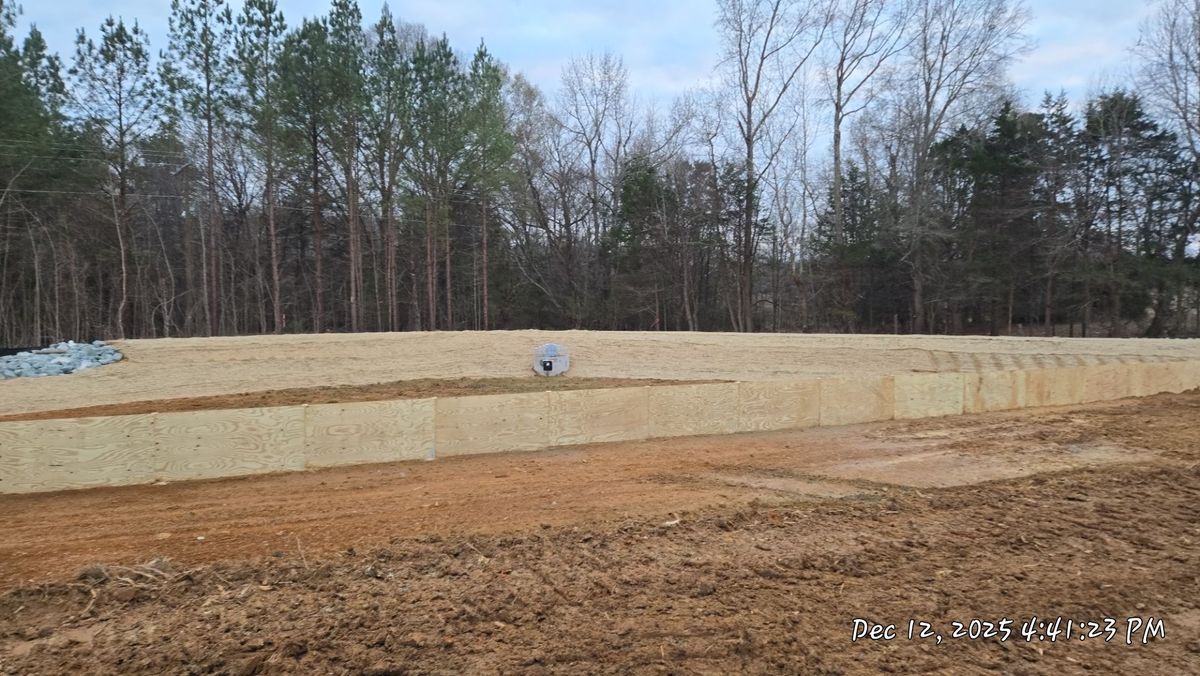 Completed stormwater basin embankment with stabilized side slopes