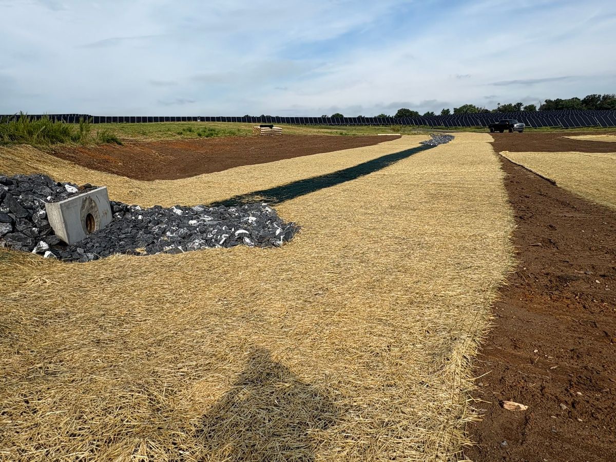 Stabilized stormwater channels with straw cover and riprap protection